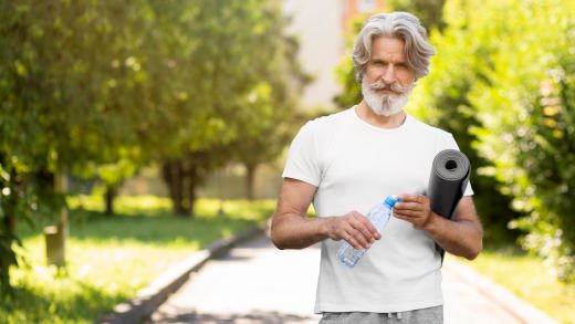 front-view-man-with-yoga-mat-water