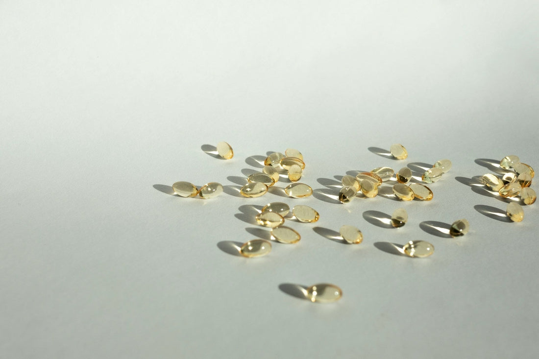 Scattered gold vitamin tablets